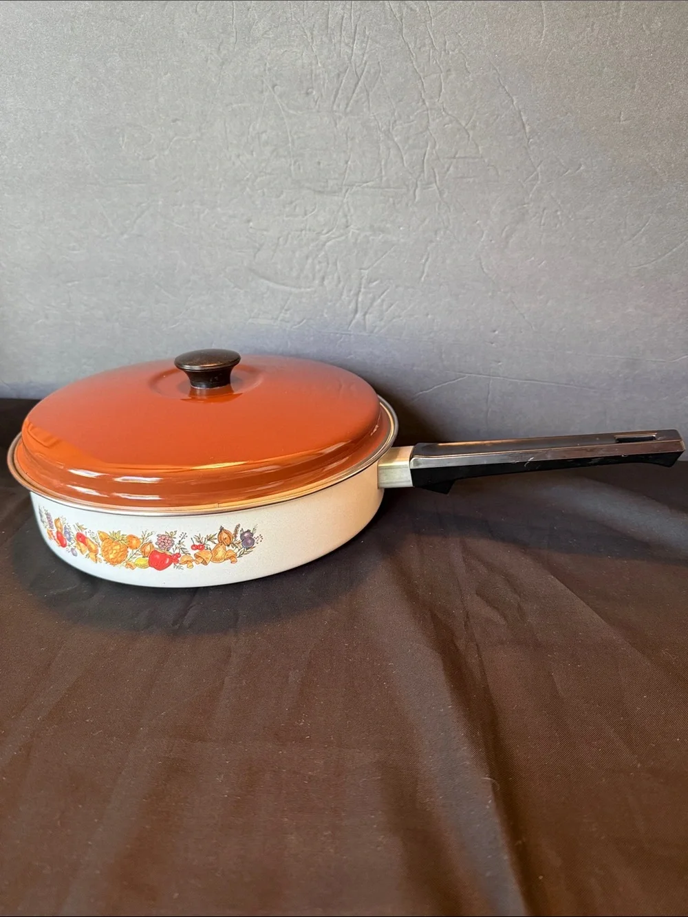 1970s enamelware skillet  featuring a retro “Spice of Life” motif.